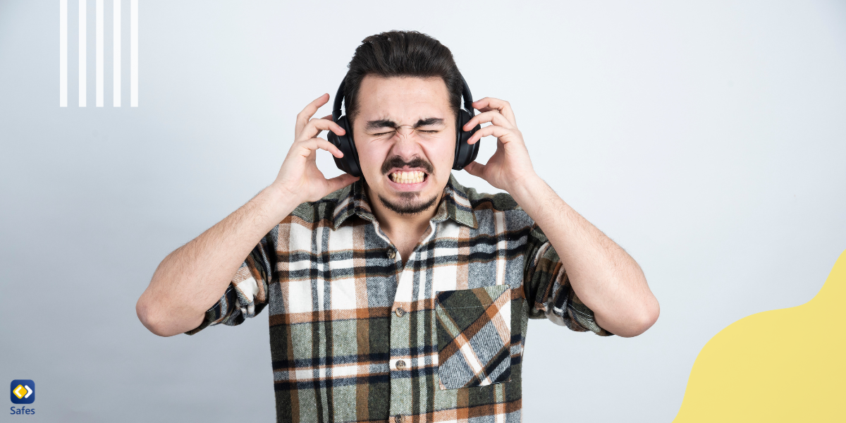 A man endangering his hearing health by listening to loud music on headphones.