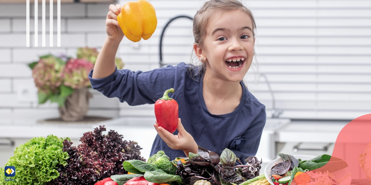 A girl behind a table full of different vegetables that are good for her health.