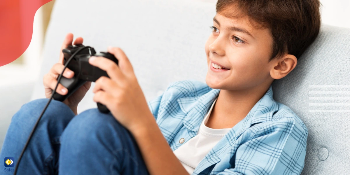 Little boy playing video games with wired controller