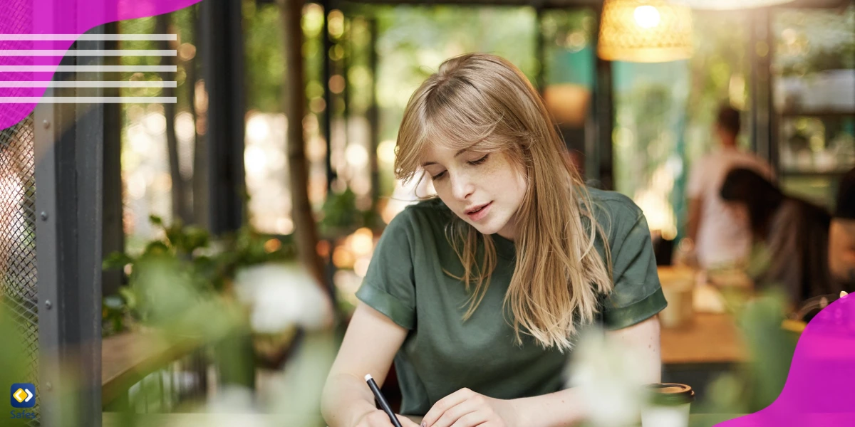 A teenage girl writing fanfiction in her notebook.