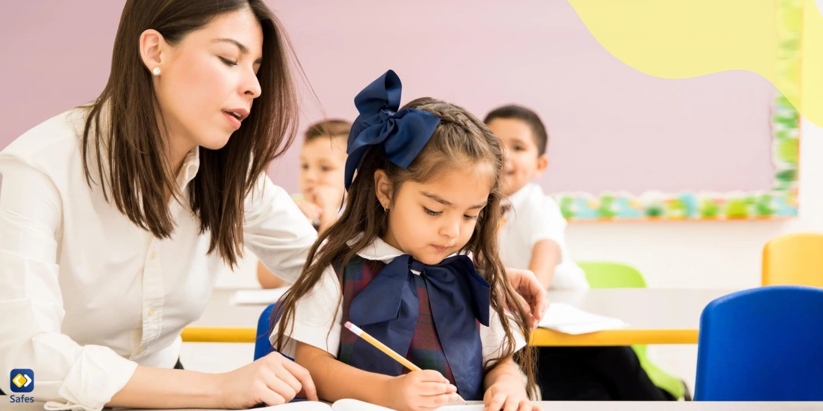 Teacher helping new student in class