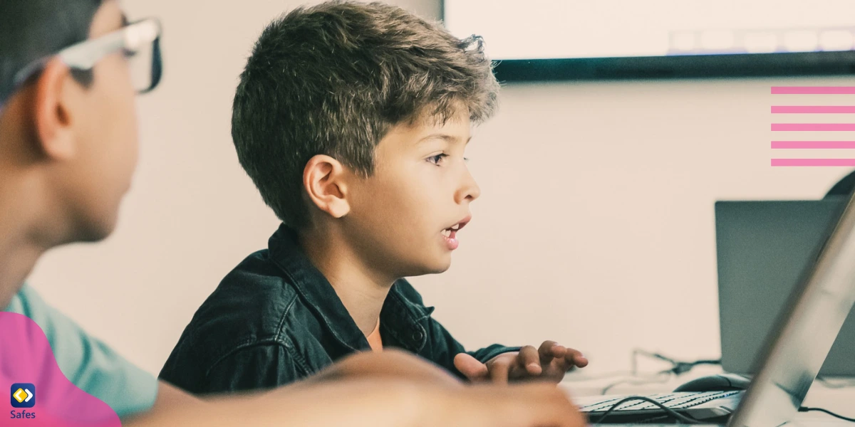 Two boys learning how to code.