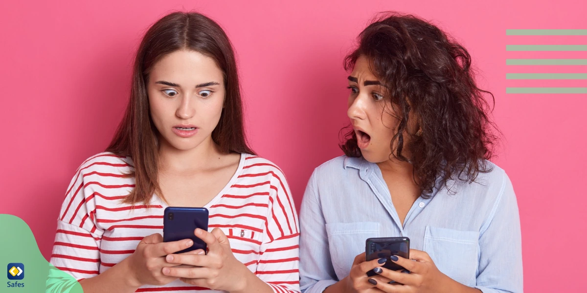 Two teenage girls reading mean comments about themselves under a YouTube video.