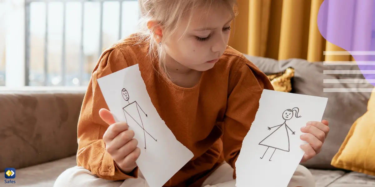 A young girl looking at the drawings of divorced parents, drawn on torn sheets of paper.