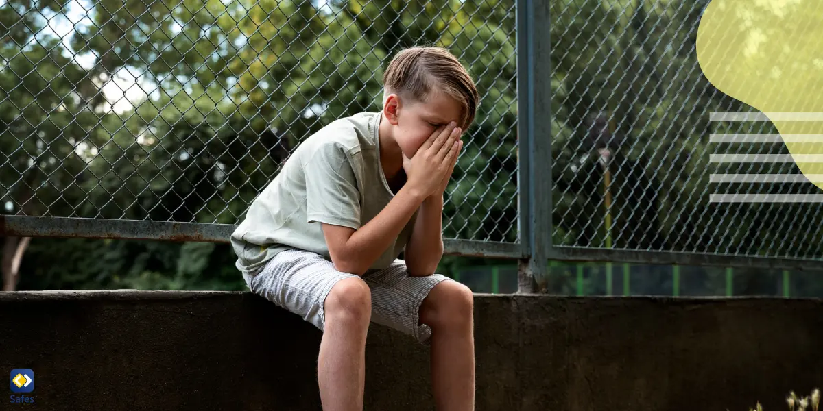 A teenage boy feeling sad after experiencing disrespect and negative behavior from his friends.