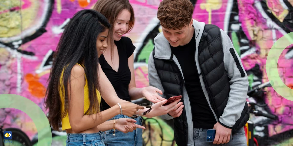 happy teens looking at their phone