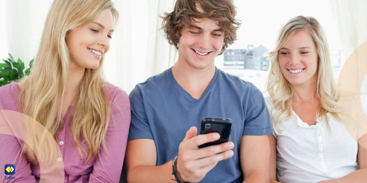Three friends sitting and looking into the phone