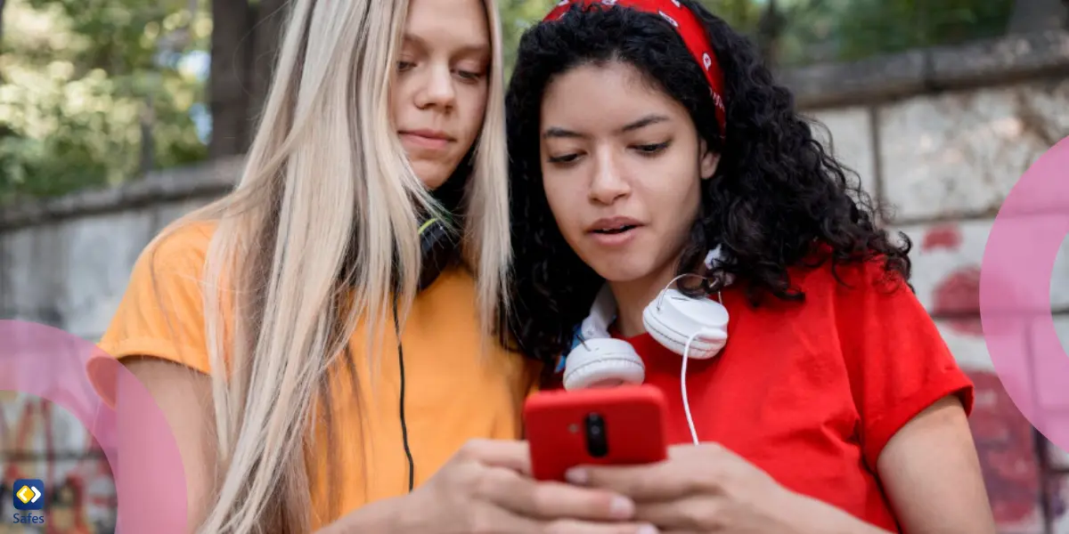 two girls looking at a phone