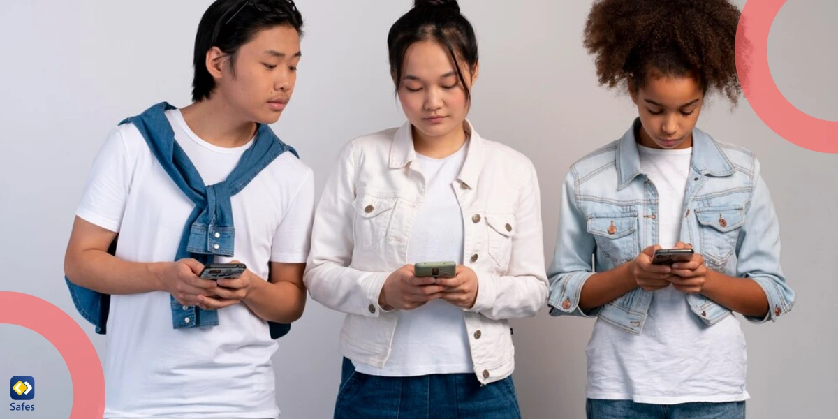 three teens using their smartphones