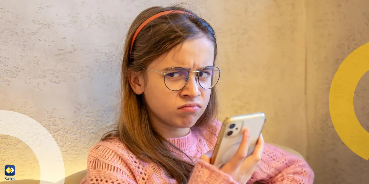 teen girl looking disgusted sideways up from her phone